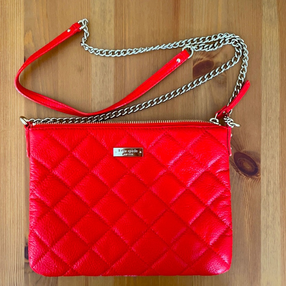 Red Kate Spade shoulder bag with gold hardware